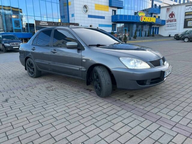 Серый Мицубиси Лансер, объемом двигателя 1.6 л и пробегом 279 тыс. км за 3990 $, фото 1 на Automoto.ua