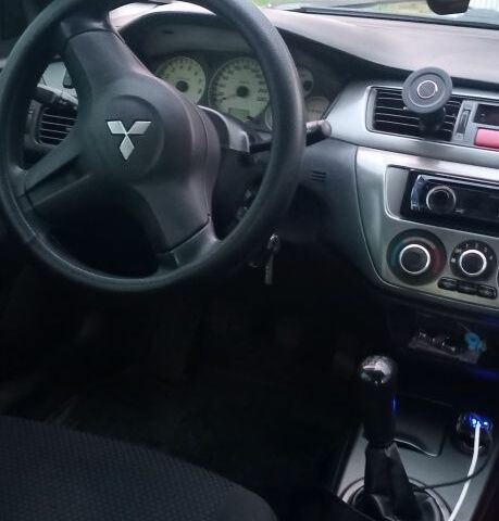 Серый Мицубиси Лансер, объемом двигателя 1.6 л и пробегом 270 тыс. км за 3700 $, фото 6 на Automoto.ua