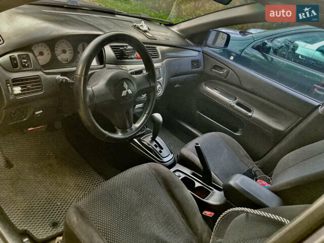 Сірий Міцубісі Lancer, об'ємом двигуна 1.6 л та пробігом 222 тис. км за 4900 $, фото 7 на Automoto.ua