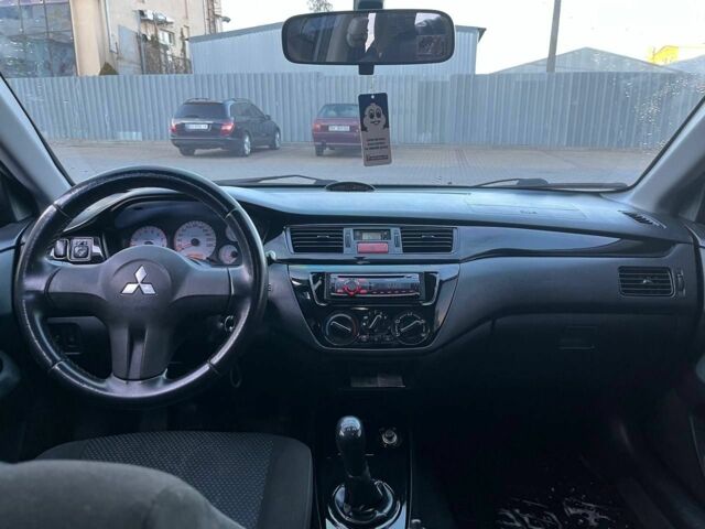 Серый Мицубиси Лансер, объемом двигателя 1.6 л и пробегом 279 тыс. км за 3990 $, фото 6 на Automoto.ua