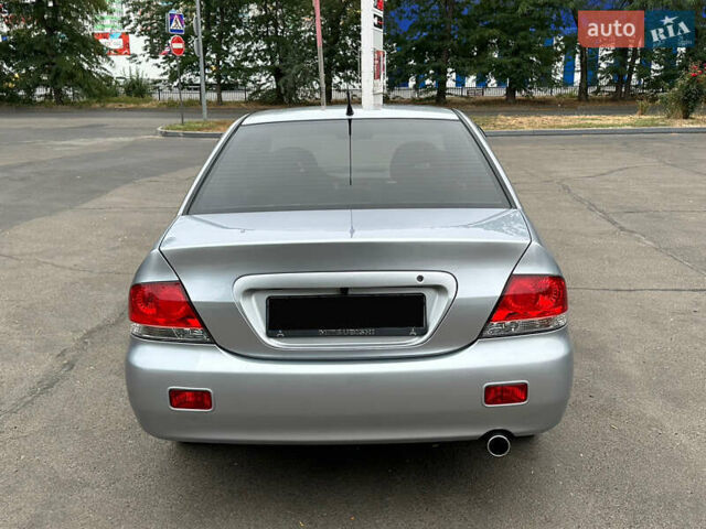 Серый Мицубиси Лансер, объемом двигателя 1.58 л и пробегом 183 тыс. км за 4800 $, фото 10 на Automoto.ua