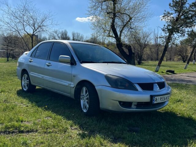 Сірий Міцубісі Lancer, об'ємом двигуна 2 л та пробігом 290 тис. км за 3900 $, фото 3 на Automoto.ua