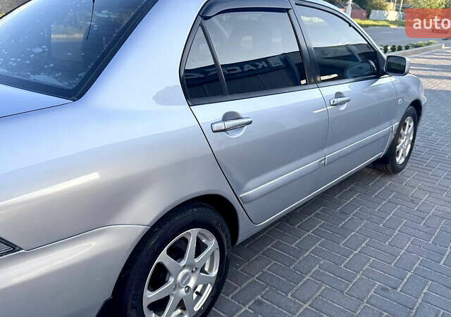 Сірий Міцубісі Lancer, об'ємом двигуна 1.6 л та пробігом 263 тис. км за 4900 $, фото 19 на Automoto.ua