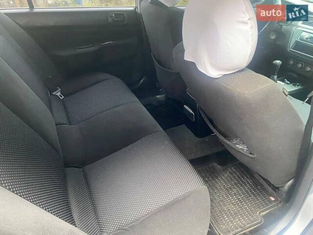 Сірий Міцубісі Lancer, об'ємом двигуна 1.58 л та пробігом 238 тис. км за 5000 $, фото 1 на Automoto.ua