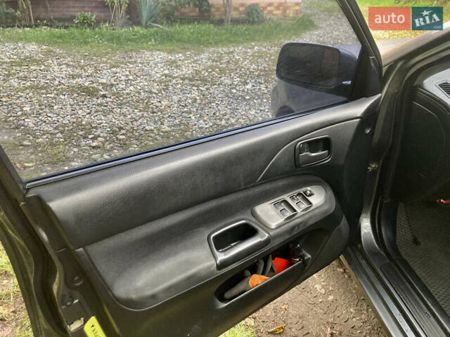 Сірий Міцубісі Lancer, об'ємом двигуна 1.6 л та пробігом 222 тис. км за 4900 $, фото 6 на Automoto.ua