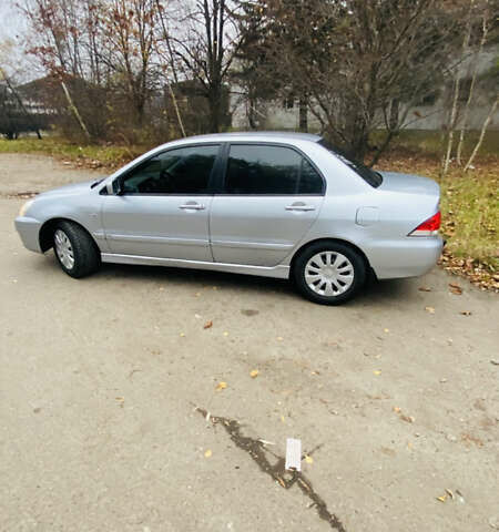 Серый Мицубиси Лансер, объемом двигателя 1.6 л и пробегом 253 тыс. км за 2850 $, фото 3 на Automoto.ua