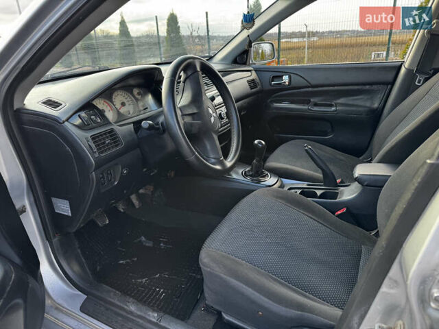 Сірий Міцубісі Lancer, об'ємом двигуна 1.58 л та пробігом 333 тис. км за 2700 $, фото 9 на Automoto.ua