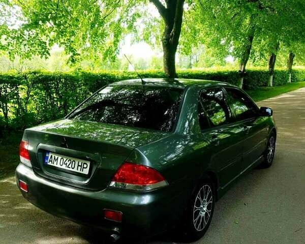 Сірий Міцубісі Lancer, об'ємом двигуна 1.58 л та пробігом 220 тис. км за 4500 $, фото 1 на Automoto.ua