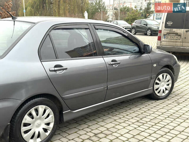 Сірий Міцубісі Lancer, об'ємом двигуна 1.6 л та пробігом 177 тис. км за 2800 $, фото 9 на Automoto.ua