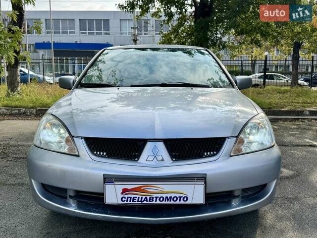 Сірий Міцубісі Lancer, об'ємом двигуна 1.58 л та пробігом 138 тис. км за 4990 $, фото 7 на Automoto.ua