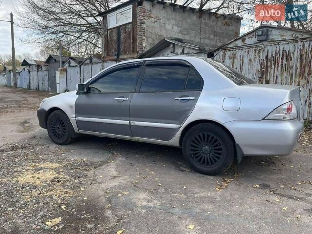 Сірий Міцубісі Lancer, об'ємом двигуна 1.58 л та пробігом 305 тис. км за 3300 $, фото 2 на Automoto.ua