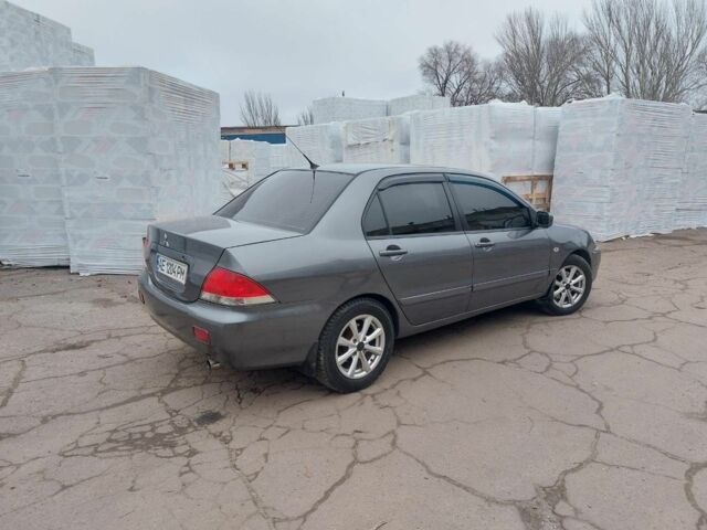 Серый Мицубиси Лансер, объемом двигателя 1.6 л и пробегом 220 тыс. км за 4200 $, фото 4 на Automoto.ua