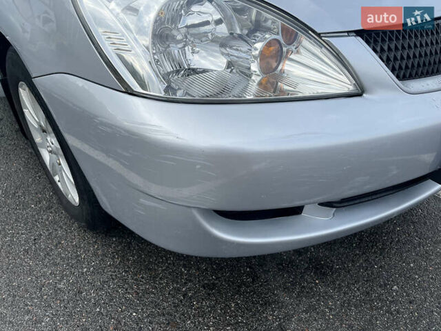 Серый Мицубиси Лансер, объемом двигателя 1.58 л и пробегом 232 тыс. км за 4900 $, фото 4 на Automoto.ua