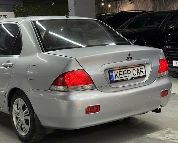 Серый Мицубиси Лансер, объемом двигателя 1.58 л и пробегом 271 тыс. км за 4200 $, фото 16 на Automoto.ua
