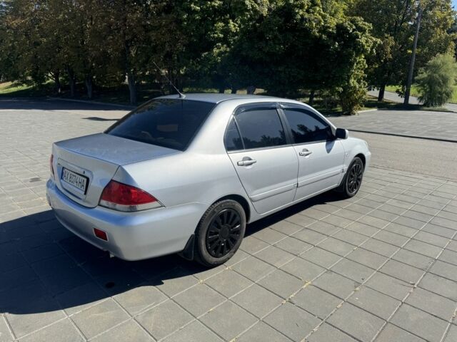 Серый Мицубиси Лансер, объемом двигателя 1.6 л и пробегом 265 тыс. км за 4100 $, фото 3 на Automoto.ua