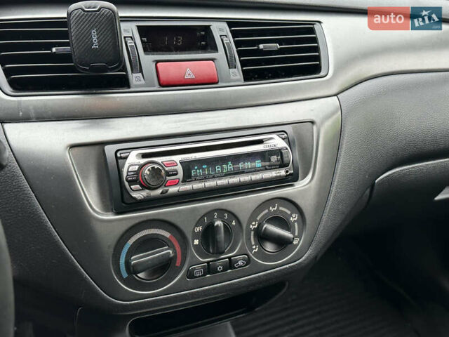 Сірий Міцубісі Lancer, об'ємом двигуна 1.6 л та пробігом 116 тис. км за 5199 $, фото 19 на Automoto.ua
