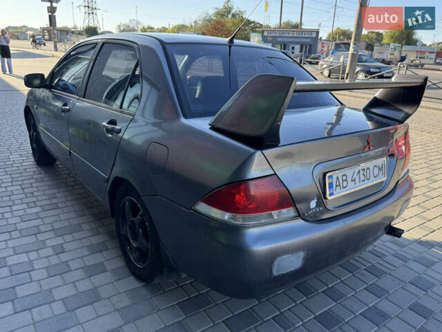 Сірий Міцубісі Lancer, об'ємом двигуна 1.58 л та пробігом 341 тис. км за 2200 $, фото 11 на Automoto.ua