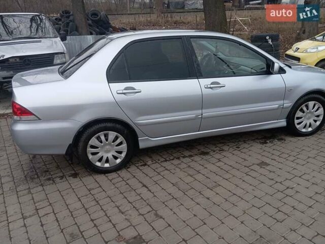 Серый Мицубиси Лансер, объемом двигателя 1.6 л и пробегом 175 тыс. км за 4200 $, фото 8 на Automoto.ua