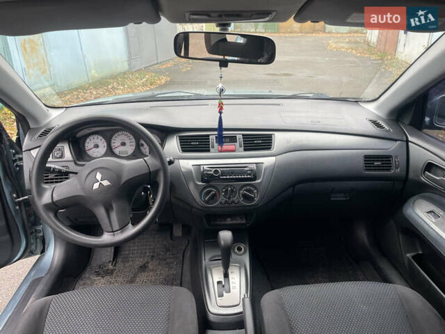 Серый Мицубиси Лансер, объемом двигателя 1.58 л и пробегом 205 тыс. км за 4750 $, фото 8 на Automoto.ua