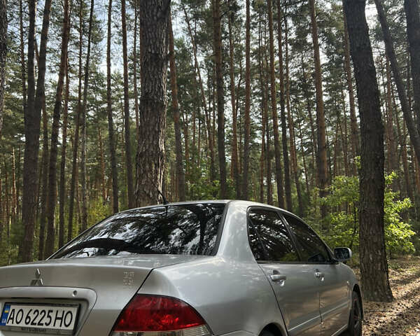 Серый Мицубиси Лансер, объемом двигателя 1.6 л и пробегом 248 тыс. км за 3000 $, фото 6 на Automoto.ua