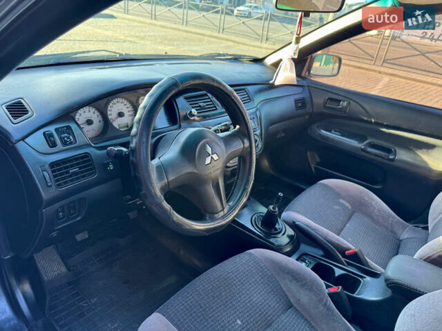 Сірий Міцубісі Lancer, об'ємом двигуна 1.58 л та пробігом 341 тис. км за 2200 $, фото 12 на Automoto.ua