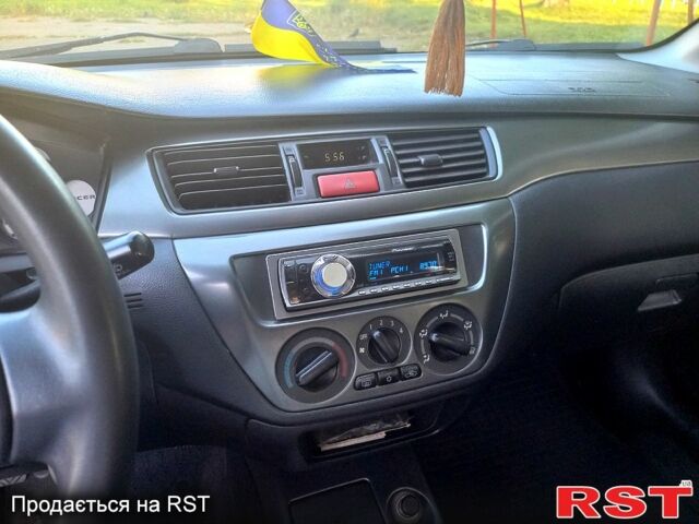 Сірий Міцубісі Lancer, об'ємом двигуна 1.6 л та пробігом 225 тис. км за 3200 $, фото 4 на Automoto.ua