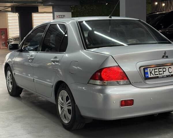 Серый Мицубиси Лансер, объемом двигателя 1.58 л и пробегом 271 тыс. км за 4200 $, фото 14 на Automoto.ua