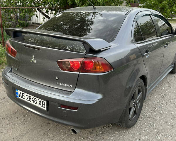 Сірий Міцубісі Lancer, об'ємом двигуна 2 л та пробігом 215 тис. км за 6900 $, фото 20 на Automoto.ua