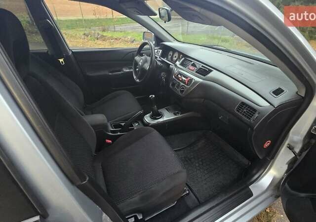 Сірий Міцубісі Lancer, об'ємом двигуна 1.6 л та пробігом 213 тис. км за 3600 $, фото 40 на Automoto.ua