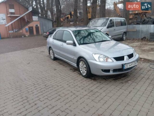 Серый Мицубиси Лансер, объемом двигателя 1.58 л и пробегом 175 тыс. км за 4000 $, фото 1 на Automoto.ua