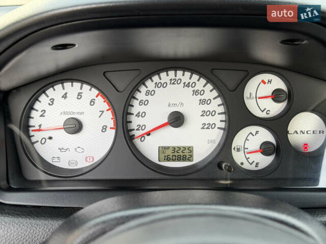 Серый Мицубиси Лансер, объемом двигателя 1.3 л и пробегом 160 тыс. км за 5555 $, фото 49 на Automoto.ua