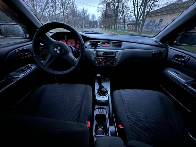 Сірий Міцубісі Lancer, об'ємом двигуна 1.6 л та пробігом 210 тис. км за 4750 $, фото 9 на Automoto.ua
