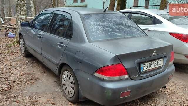 Серый Мицубиси Лансер, объемом двигателя 1.6 л и пробегом 246 тыс. км за 4200 $, фото 2 на Automoto.ua