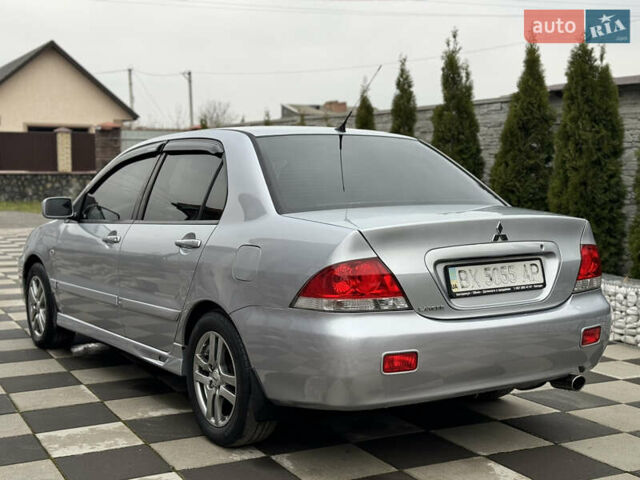 Сірий Міцубісі Lancer, об'ємом двигуна 1.6 л та пробігом 281 тис. км за 3999 $, фото 12 на Automoto.ua