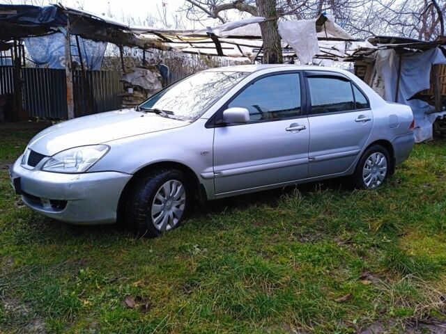 Сірий Міцубісі Lancer, об'ємом двигуна 1 л та пробігом 400 тис. км за 2850 $, фото 2 на Automoto.ua