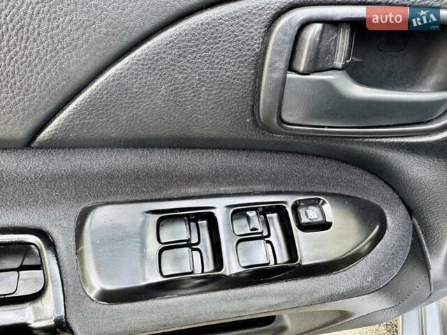 Сірий Міцубісі Lancer, об'ємом двигуна 1.58 л та пробігом 138 тис. км за 4990 $, фото 24 на Automoto.ua