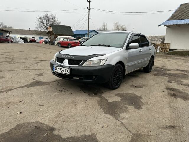 Серый Мицубиси Лансер, объемом двигателя 1.6 л и пробегом 298 тыс. км за 3600 $, фото 1 на Automoto.ua