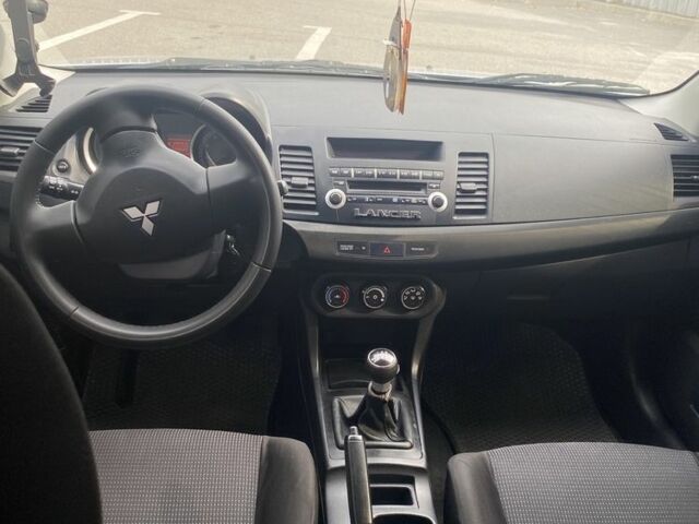 Серый Мицубиси Лансер, объемом двигателя 1.5 л и пробегом 188 тыс. км за 4999 $, фото 5 на Automoto.ua