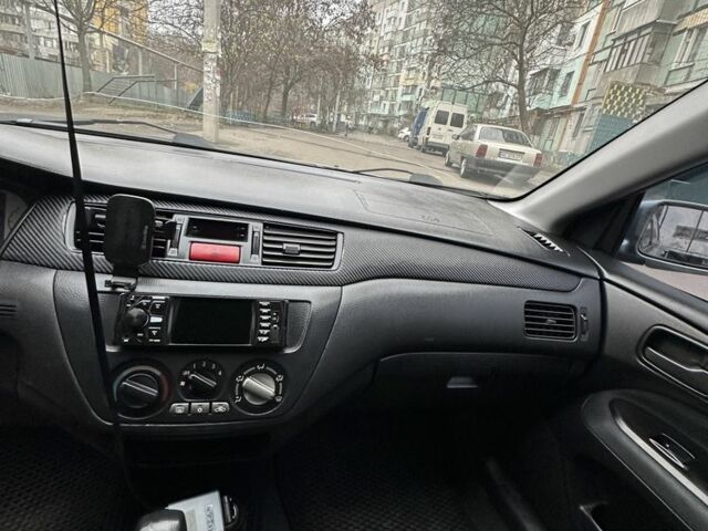 Серый Мицубиси Лансер, объемом двигателя 1.6 л и пробегом 238 тыс. км за 4300 $, фото 8 на Automoto.ua