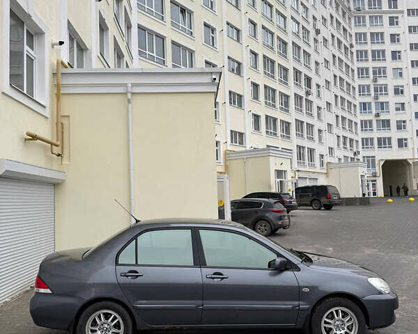 Серый Мицубиси Лансер, объемом двигателя 1.58 л и пробегом 187 тыс. км за 4800 $, фото 2 на Automoto.ua