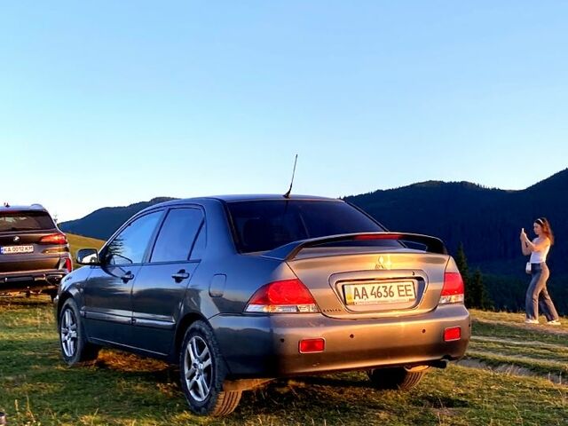 Сірий Міцубісі Lancer, об'ємом двигуна 1.6 л та пробігом 240 тис. км за 4450 $, фото 3 на Automoto.ua