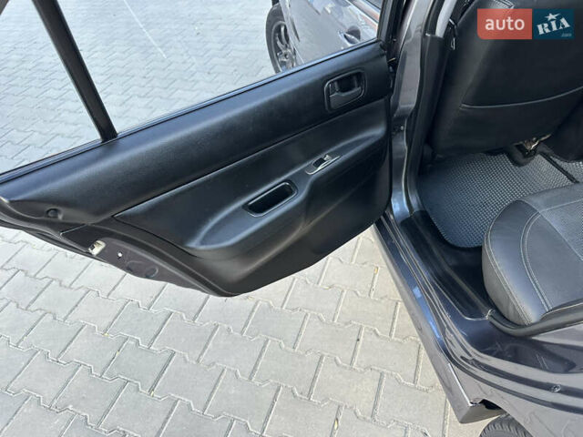 Сірий Міцубісі Lancer, об'ємом двигуна 1.6 л та пробігом 189 тис. км за 6200 $, фото 13 на Automoto.ua