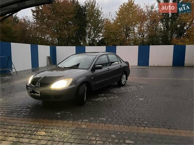 Сірий Міцубісі Lancer, об'ємом двигуна 1.6 л та пробігом 330 тис. км за 3500 $, фото 28 на Automoto.ua