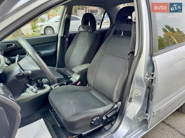 Сірий Міцубісі Lancer, об'ємом двигуна 1.58 л та пробігом 138 тис. км за 4990 $, фото 16 на Automoto.ua