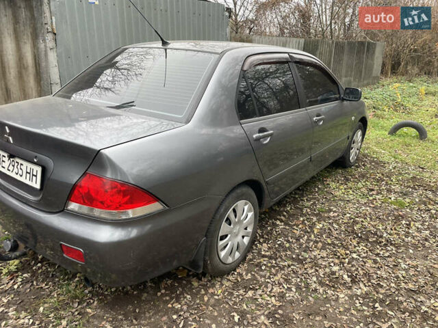 Сірий Міцубісі Lancer, об'ємом двигуна 1.58 л та пробігом 290 тис. км за 3500 $, фото 1 на Automoto.ua