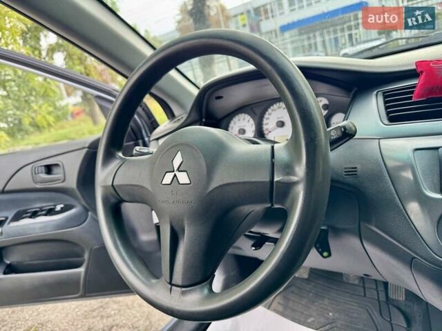 Сірий Міцубісі Lancer, об'ємом двигуна 1.58 л та пробігом 138 тис. км за 4990 $, фото 27 на Automoto.ua