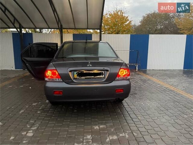 Сірий Міцубісі Lancer, об'ємом двигуна 1.6 л та пробігом 330 тис. км за 3500 $, фото 25 на Automoto.ua