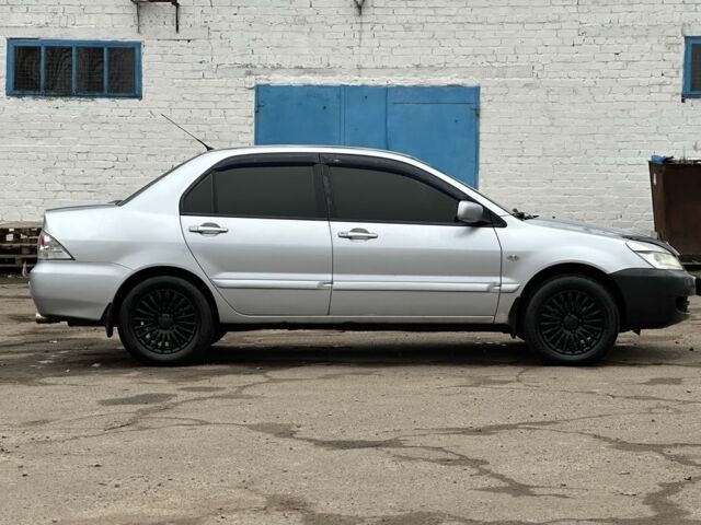 Серый Мицубиси Лансер, объемом двигателя 1.6 л и пробегом 298 тыс. км за 3600 $, фото 3 на Automoto.ua