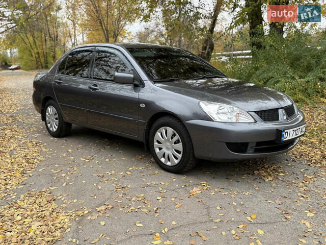 Сірий Міцубісі Lancer, об'ємом двигуна 1.58 л та пробігом 247 тис. км за 4900 $, фото 2 на Automoto.ua