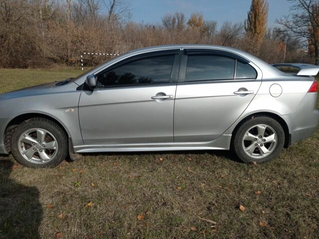 Серый Мицубиси Лансер, объемом двигателя 2 л и пробегом 180 тыс. км за 5800 $, фото 12 на Automoto.ua